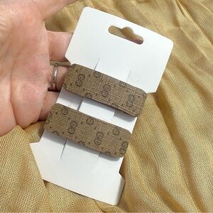 Upcycled Gucci vintage brown monogram bag into barrettes set clips
